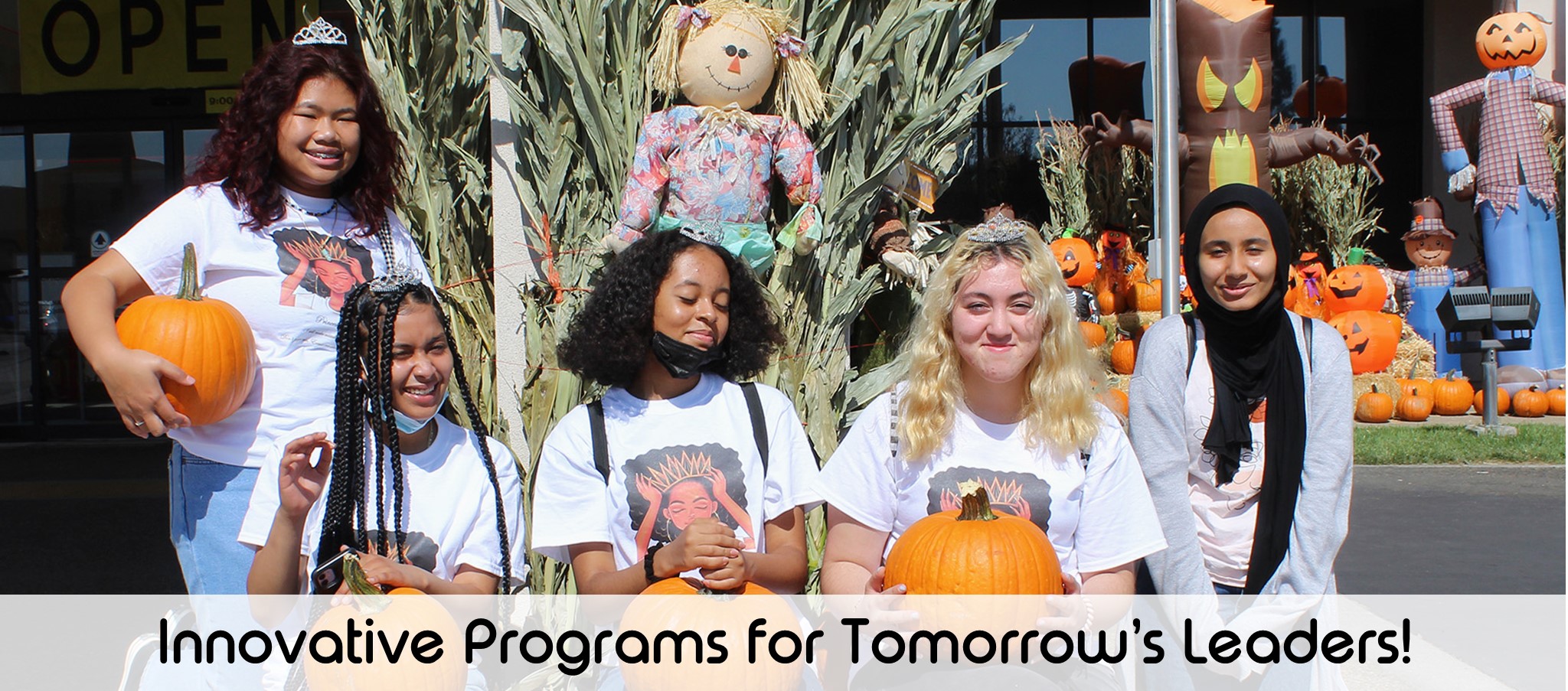Girls holding pumpkins a text overlay reads Innovative programs for tomorrow's Leaders!
